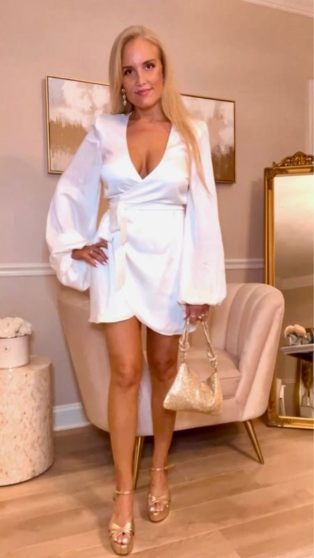 This white silk long sleeve wrap dress is total luxury and perfect for any special occasion! Obsessed 🤩🤩 

#LTKSeasonal #LTKHoliday #LTKstyletip