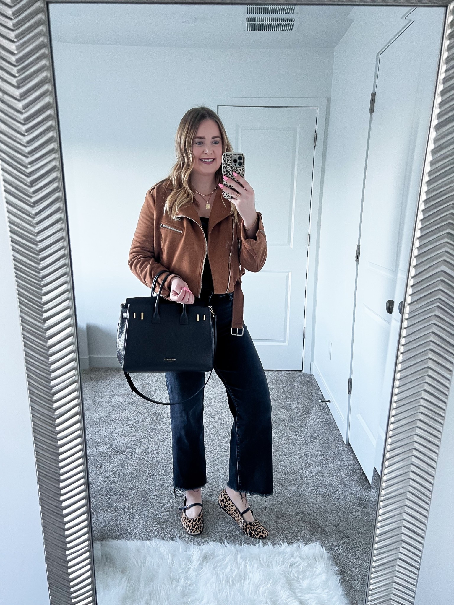 Casual work outfit🖤 moto jacket with wide leg black jeans and leopard ballet flats for a little edge, finished with my go to black work bag, polished but cool, business casual outfit, neutral style, effortless office look

#LTKootd #LTKMidsize #LTKWorkwear