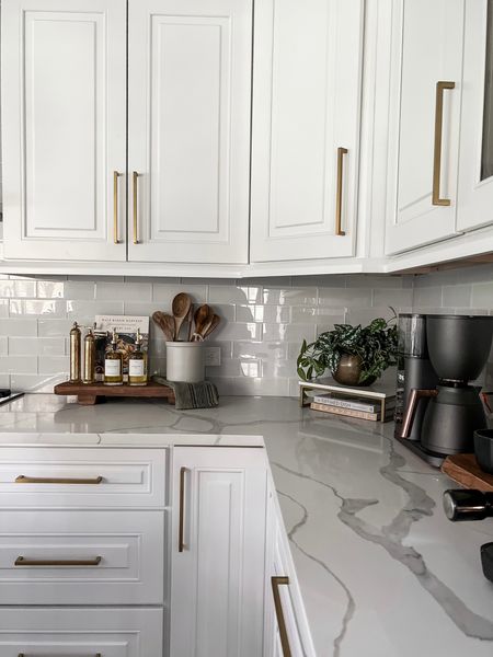 White kitchen counter styling with warm
Wood and brass tones 

#LTKunder50 #LTKFind #LTKhome