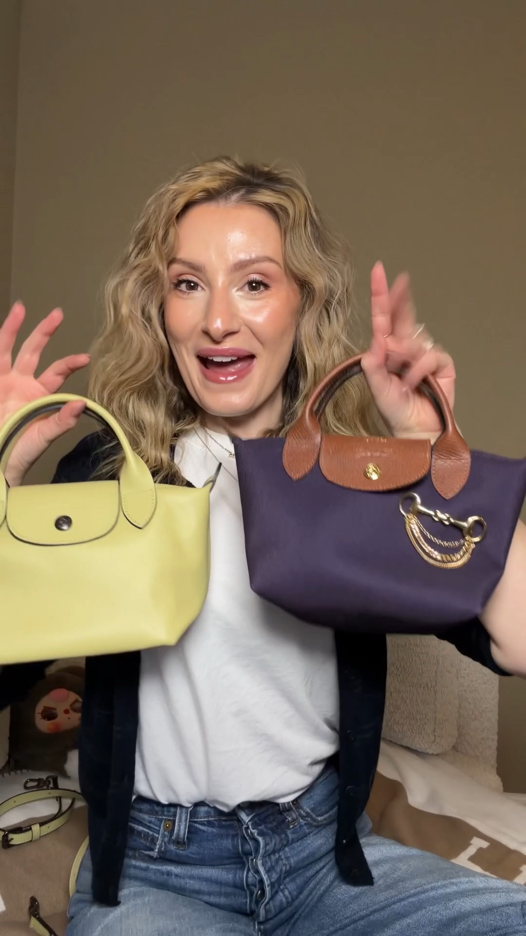 Let’s compare the Longchamp Pliage Xtra with the My Pliage signature bag 👜

These are both in the size xtra small and the sizing is cery consistent between these two even though they are from different collections.

The pliage Xtra is made entirely of leather while the my pliage signature has leather trimmings but a contton/canvas feeling body.

The longchamp xtra has loops behind the handles to atracha the crossbody strap while the pliage signature has holes punched on the side pieces to attach the strap.

You can choose you’re hardware and leather trimmings color ont he my pliage signature while the xtra trimmings match the bag body and the hardware is a gunmetal silver 
