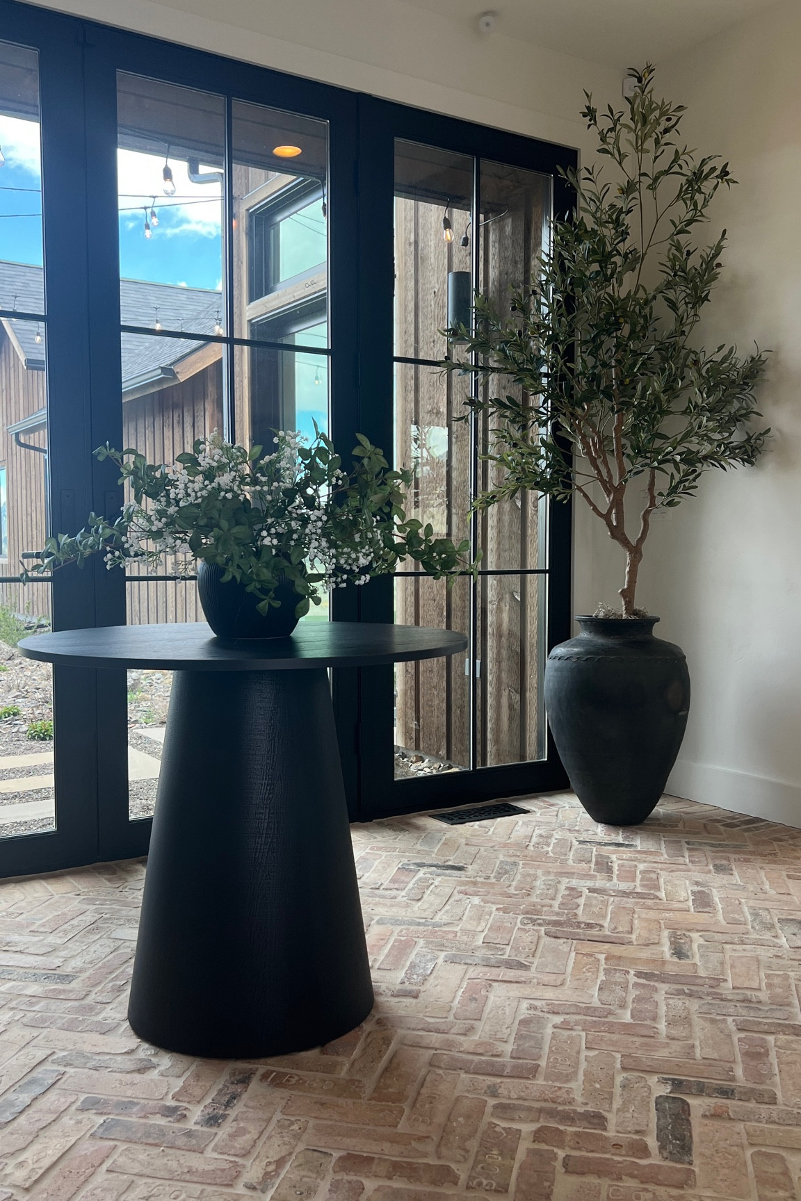 Entryway foyer decor and design

Entryway table
35” table round
Round black table
Small dining tabl
Water jug
Olive jug
Xl olive jug
Olive tree
Faux tree
Entryway tree
Accent tree
Greenery bouquet
Green stems
Babys breath faux flowers