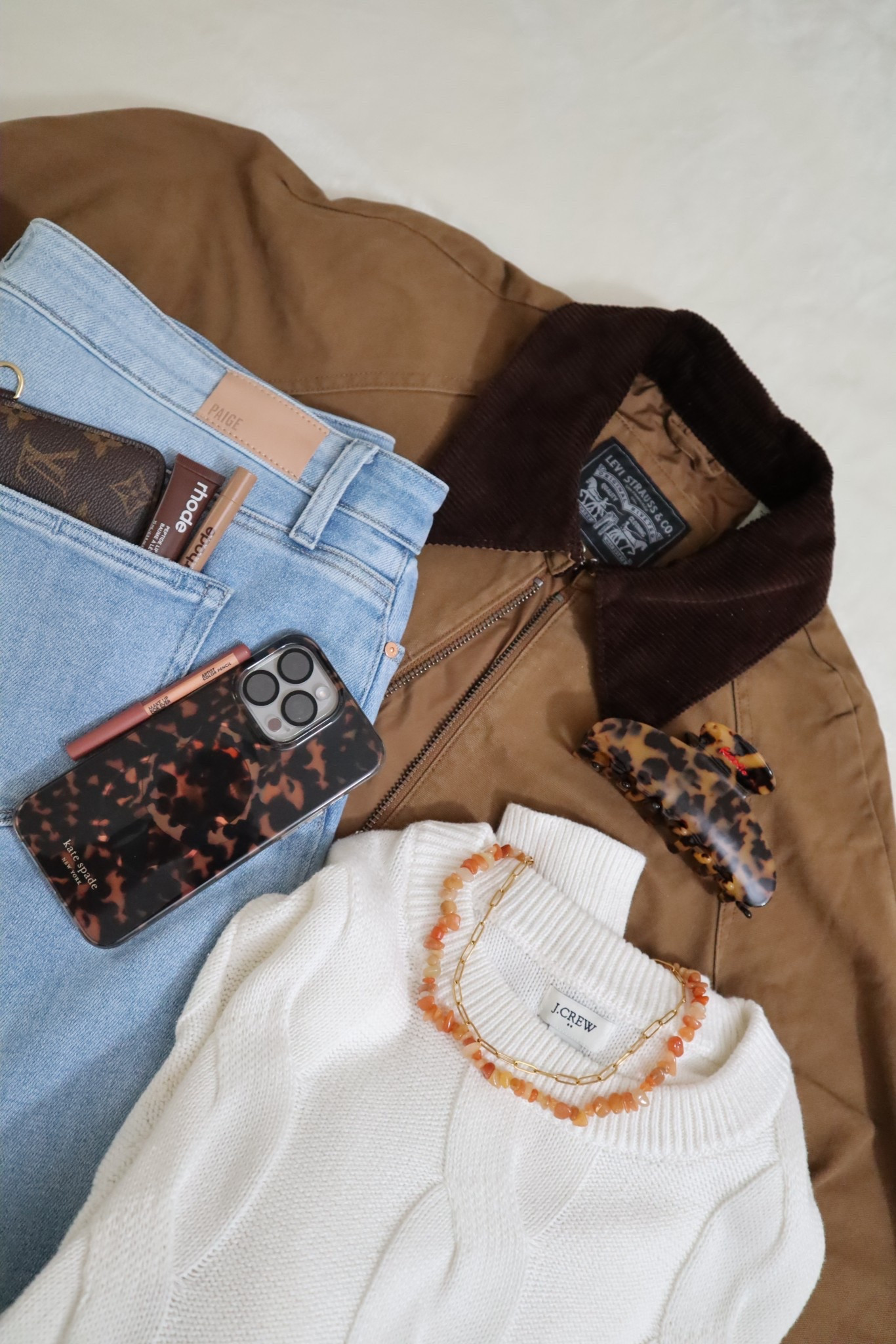 OOTD STYLE GUIDE
J crew sweater
Levi’s barn jacket
Kate spade tortoise phone case
Paige jeans
Rhode lip tint gloss
Makeup forever lip liner 
Louis Vuitton wallet

#LTKootd #LTKdayinmylife #LTKgrwm