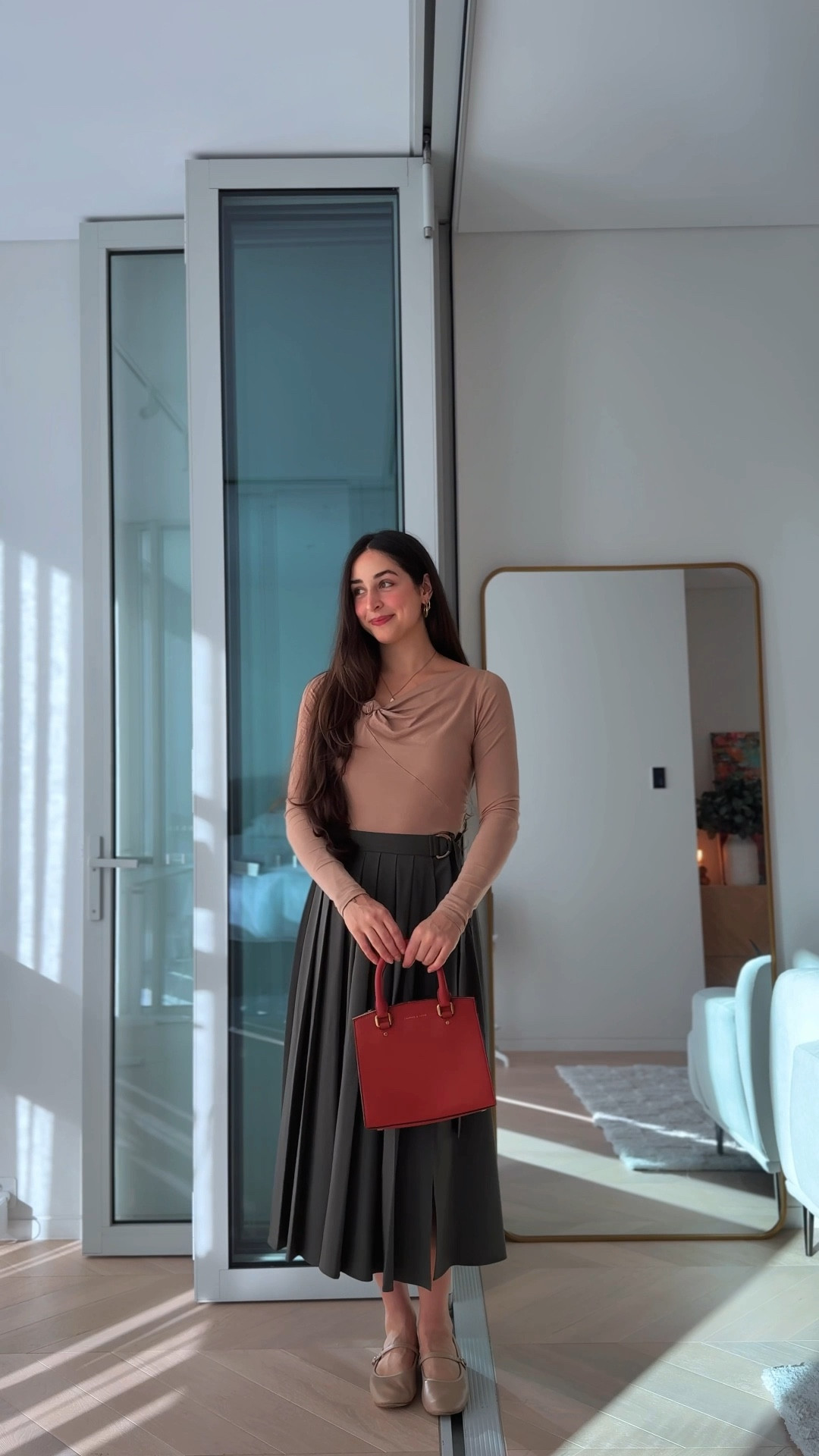 Outfit 2: Contrast

This outfit could also be described as soft contrast with a complementary accent. The khaki skirt and blush pink top are complementary (they sit opposite each other on the color wheel). 
The pop of orangey-red via the bag allows for the contrast element. The important note is the bag color choice is still complementary to the outfit, however, the orangey-red is more saturated in color, so it creates a focal point which draws your eye toward it.

Contrast could be described as “tension.” However, tension can be a good thing when the color choice is correct. In this case, the bag complements the other colors but creates just enough “tension” to add contrast and visual interest.

Mango skirt
& other stories top
Charles & Keith bag
Sandler flat shoes

#LTKwinter #LTKstyletip #LTKautumn