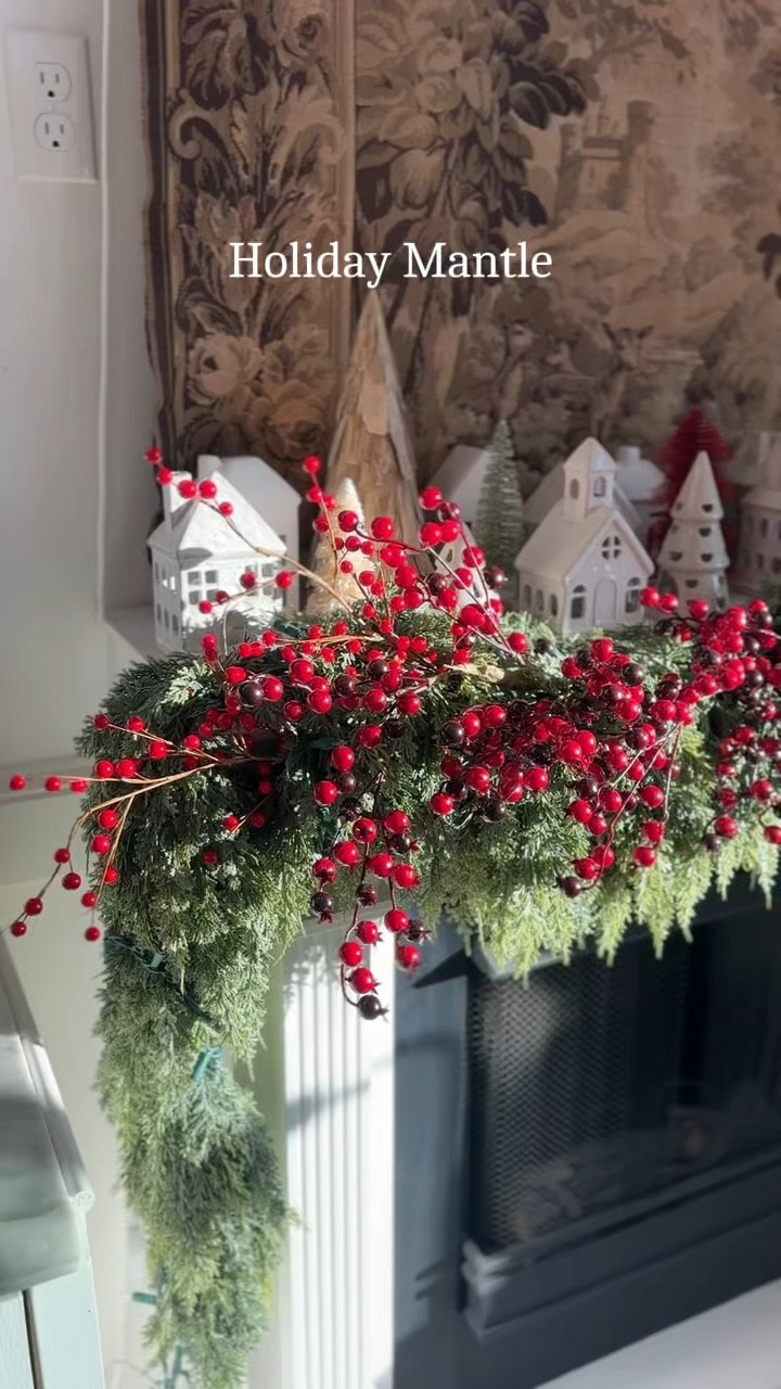 My Holiday mantel this year is a combination of real@touch cedar garland, deep red, burgundy and maroon cranberry stems and garlands and creamy artisan ceramic light up houses, and a mix of ceramic, wood, and bottle brush christmas trees! I absolutely love how it turned out. I sourced everything affordably and you can shop the look now! #christmasdecor #christmasdecorating #holiday2024 #holidaydecor #holidaydecorating #holidayseason #holidayhome

#LTKHoliday #LTKHome