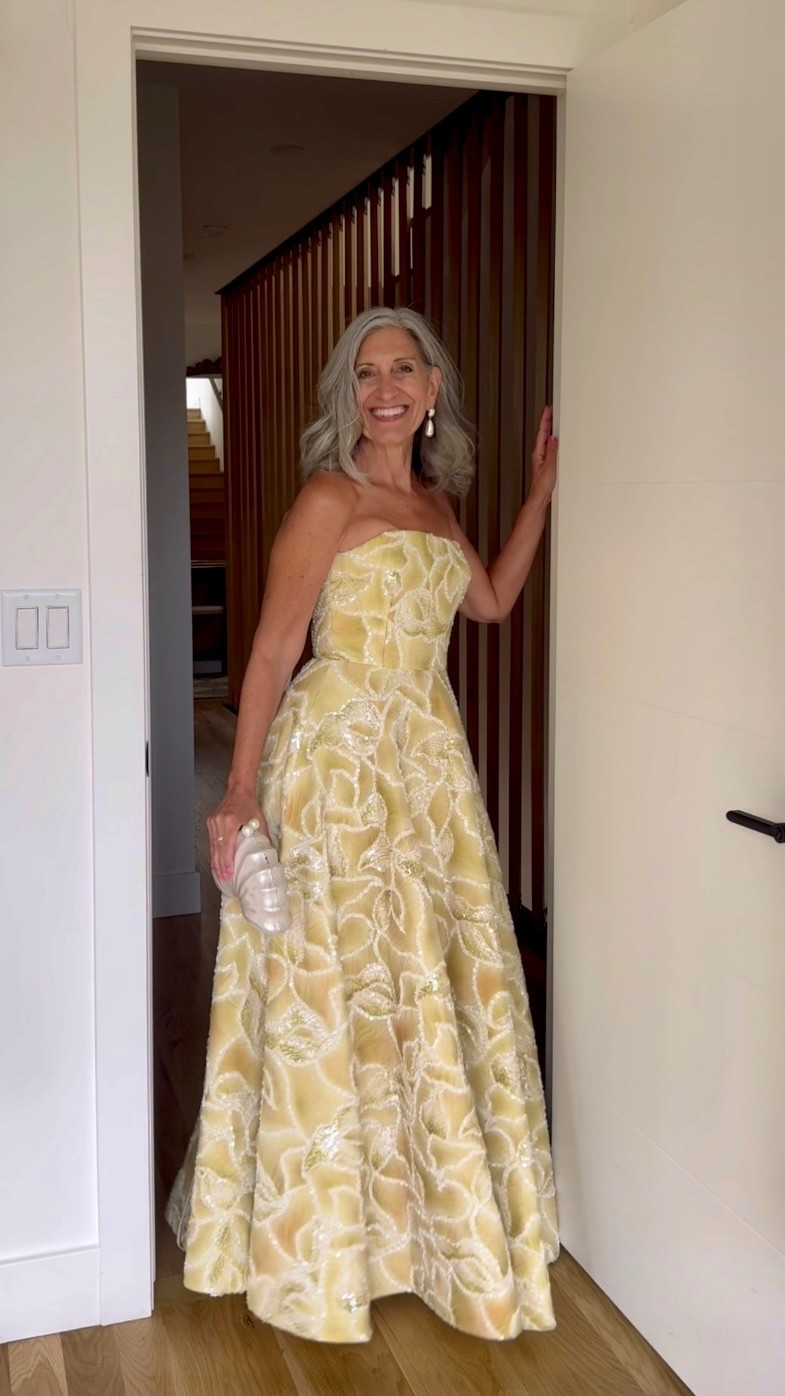 🌼 the yellow sequin floral that catches every light in the room.

A strapless golden yellow sequin floral gown with a structured bodice and a full skirt that sweeps and moves with effortless warm joy.

The dimensional floral detail photographs beautifully from every angle.

Save this for your next invitation.

Share it with a friend who's shopping. 💌

#weddingguestdress #motherofthebride #gardenwedding #springwedding #weddingseason2026

#LTKSeasonal #LTKOver40 #LTKWedding