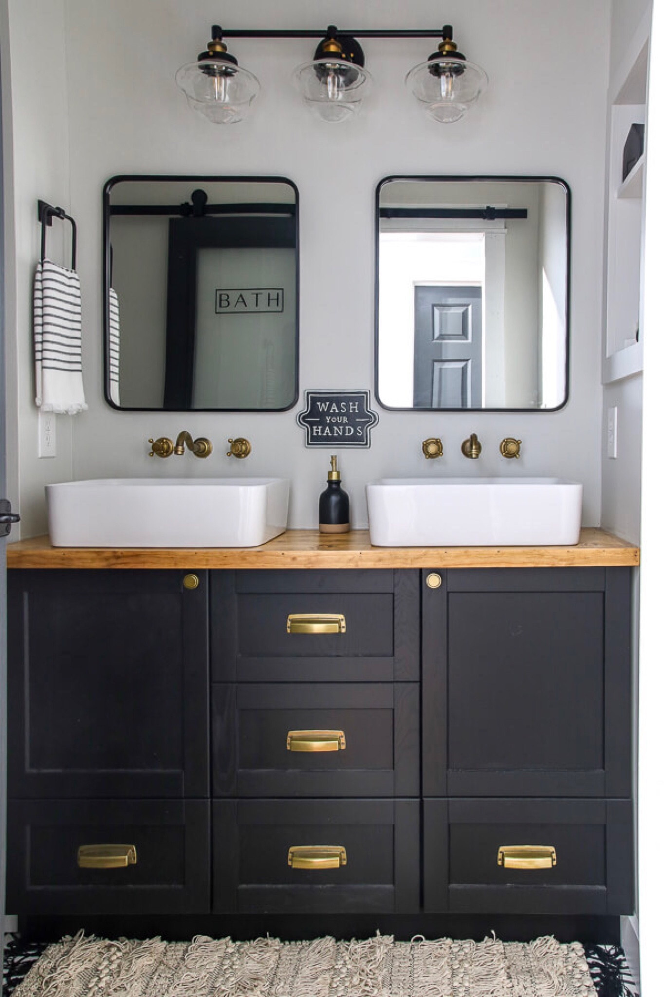 The after shot of our bathroom renovation adventures! I love how sleek and modern this looks and is a much improved version of our old bathroom.

Bathroom Renovation | Bathroom Sink |  Bathroom Mirror | Black Bathroom Mirror | Bathroom Vanity Mirror | Bathroom Decor | Bathroom Storage | Bathroom Lighting 

#LTKhome #LTKfindsunder100 #LTKsalealert