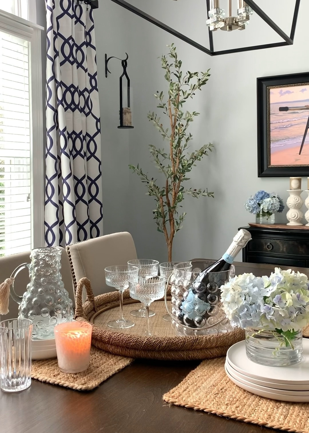 Amazon styling. My new favorites for entertaining, vintage coupe glasses, hobnail pitcher, hobnail ice bucket, glasses, white dinnerware, vase/candleholder, olive tree still on sale, tray, candle. Summer entertaining, free shipping. 

#LTKunder50 #LTKsalealert #LTKhome