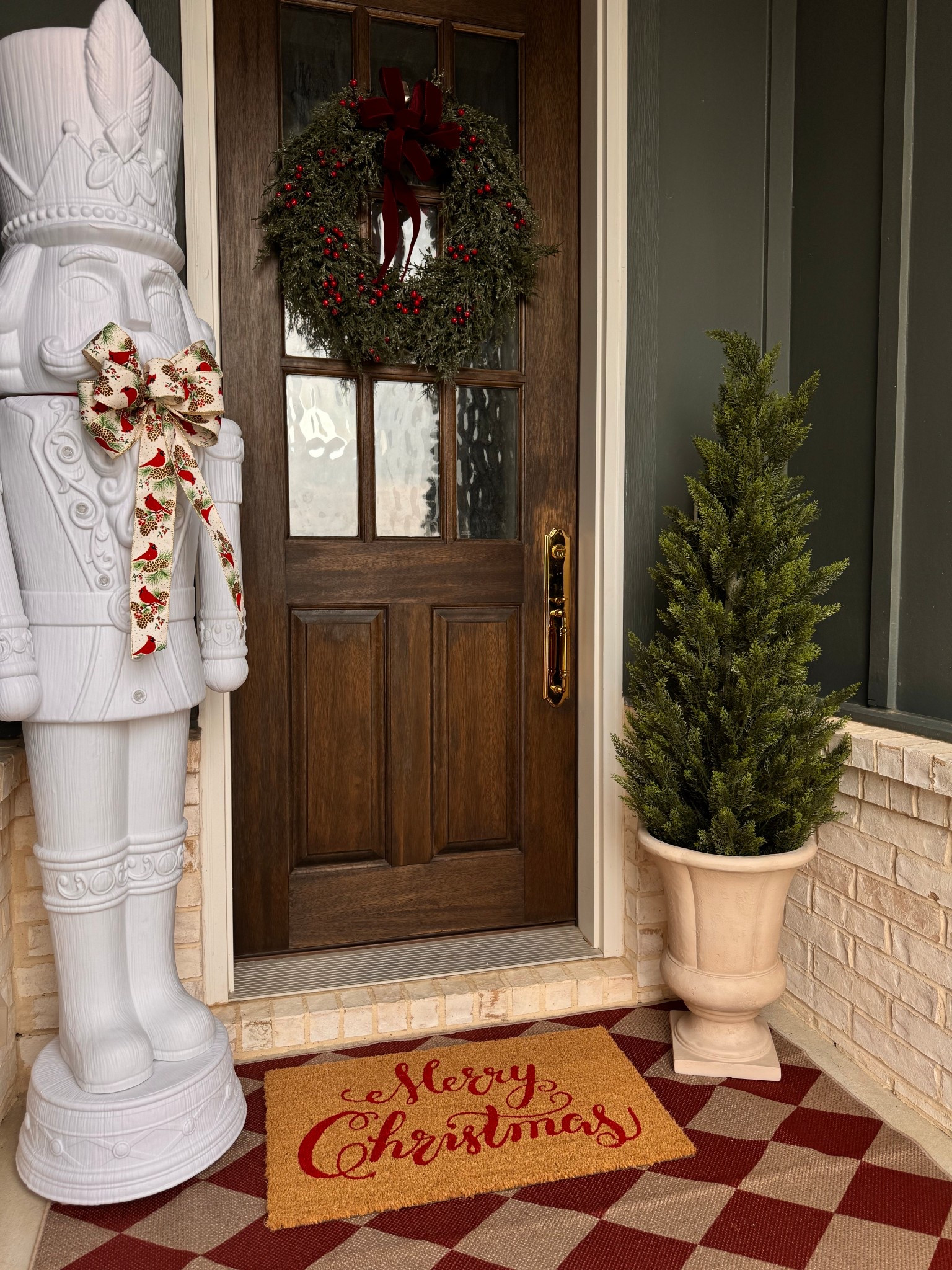 Holiday porch decor 🌲❤️
Sharing a few Christmas pieces I used to make our entryway feel cozy — the nutcracker, greenery, wreath, doormat, and porch tree are all linked for easy shopping!

Christmas porch decor, holiday entryway, outdoor Christmas decorations, nutcracker decor, porch tree, Christmas wreath, holiday doormat, festive front door, holiday home finds, neutral Christmas decor, classic Christmas style

#LTKHoliday #LTKSaleAlert #LTKCyberWeek