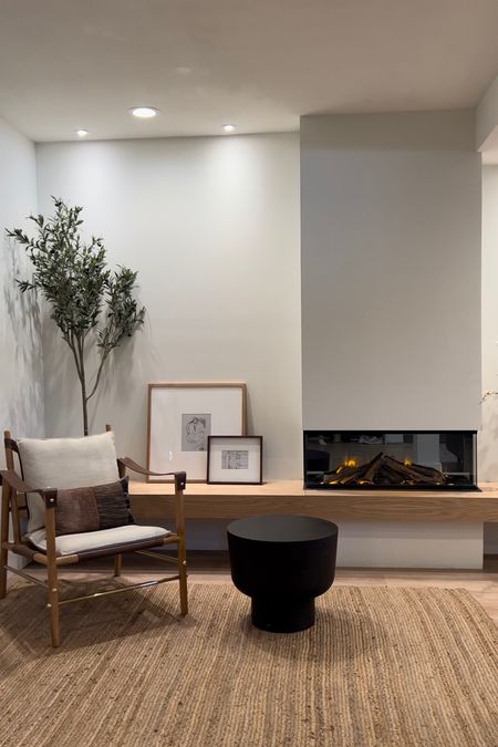 Basement fireplace remodel
Stanton chair, cb2, faux olive tree, three sided fireplace

#LTKunder100 #LTKunder50 #LTKhome