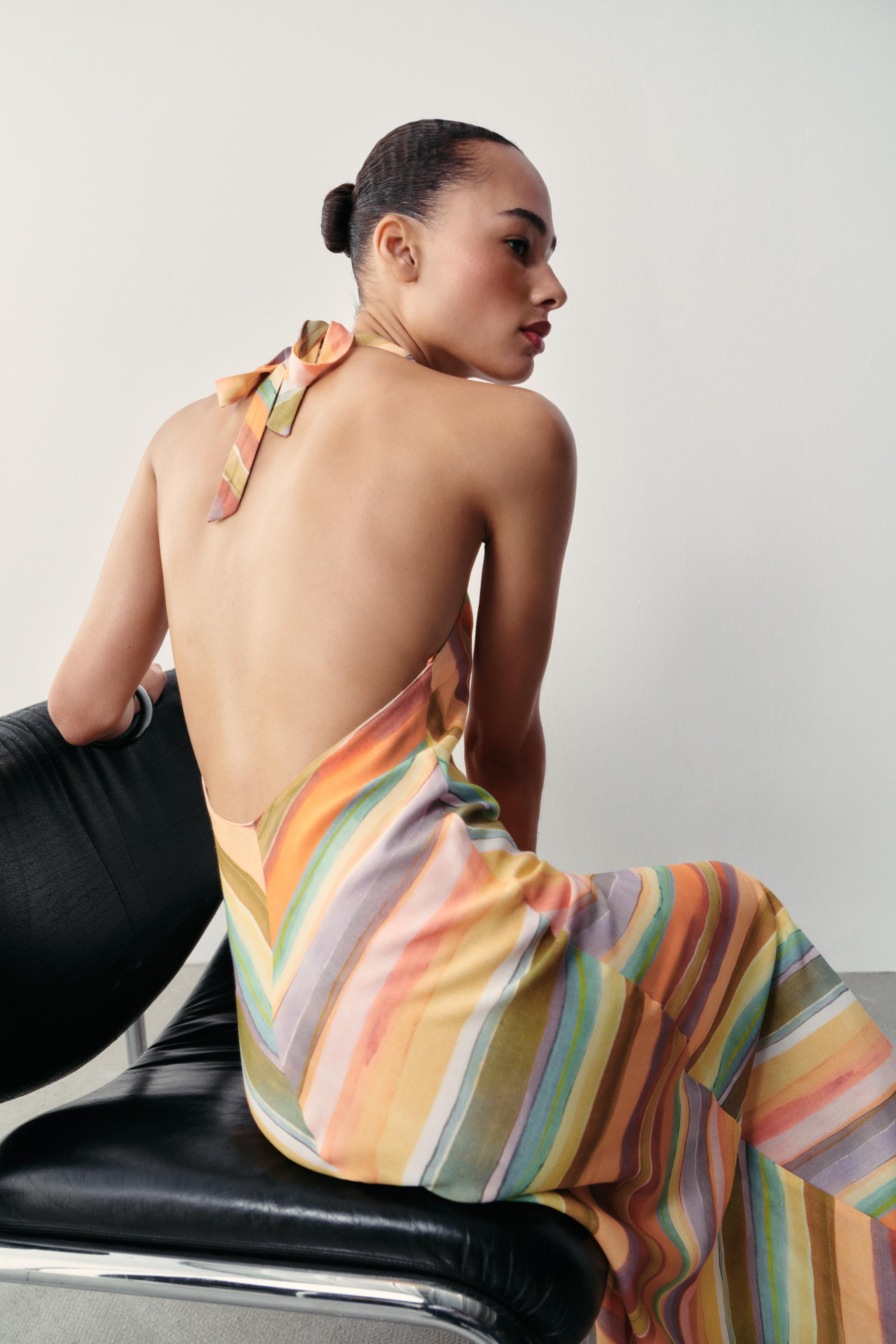 Halter neck dress with V-neckline and open back. Side hidden in-seam zip closure and back tie fas... | Zara US