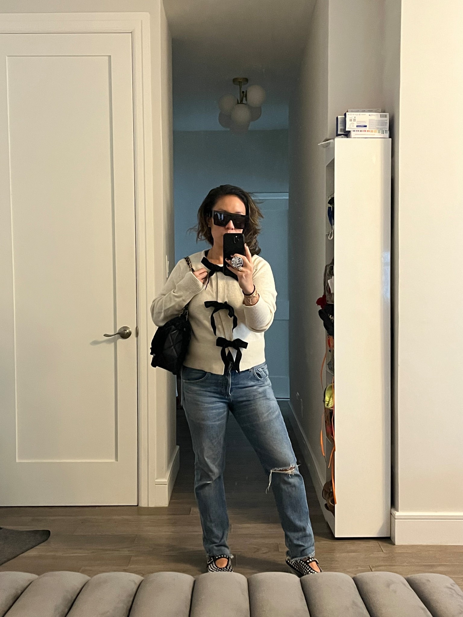 Bow sweater. Very cozy. Three colors. Snap closure. Perfect holiday look that transitions to not. We LOVE longevity. I’m wearing an xs. 

#LTKCyberWeek #LTKFindsUnder50 #LTKHoliday