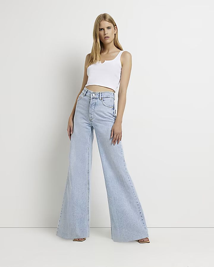 Blue mid rise ultra flared jeans | River Island (UK & IE)