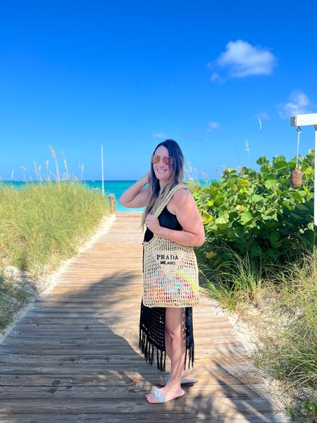 What I wore to Turks and Caicos | beach day 🏝️ resort casual. My favorite black coverup. Also wearing the miraclesuit swimsuit. I’m Normally a size 4/ medium got the size 6 and fit comfortably with still smoothing. 

#LTKswim #LTKfindsunder50 #LTKtravel