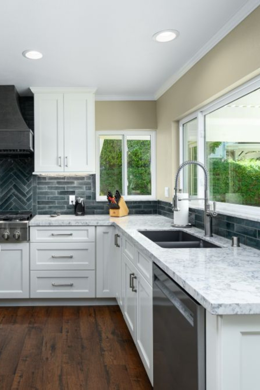 There’s something about clean lines, natural light, and subtle contrast that makes a kitchen feel fresh and timeless. In this recent remodel, we supplied custom cabinetry in a soft white shaker style that pairs beautifully with a deep charcoal sink, modern pull-down faucet, and dramatic teal backsplash tile. The marble-look quartz counters tie it all together for a look that’s as durable as it is elevated.

Whether you’re starting from scratch or refreshing your layout, our cabinetry solutions are tailored to fit your space and your style.

#KitchenRemodel #ShakerCabinets #DesignBuild #CustomCabinetry #QuartzCountertops #CoastalKitchen #LTKHome #PinterestKitchen #KitchenInspiration #InteriorDesign #CabinetDesign #KitchenSinkGoals #TimelessKitchen #BacksplashTile #RemodelReveal 

 #LTKHome