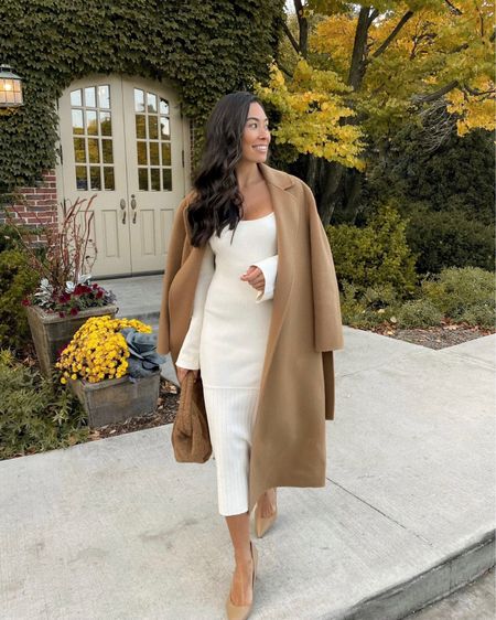 Kat Jamieson of With Love From Kat wears a fall outfit. Camel coat, midi dress, white dress, sweater dress, tan heels, tan clutch, fall style, neutral outfit. 

#LTKSeasonal #LTKstyletip