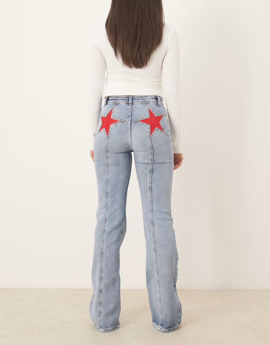Free People firecracker flare jean with red star bum graphic in blue | ASOS (Global)