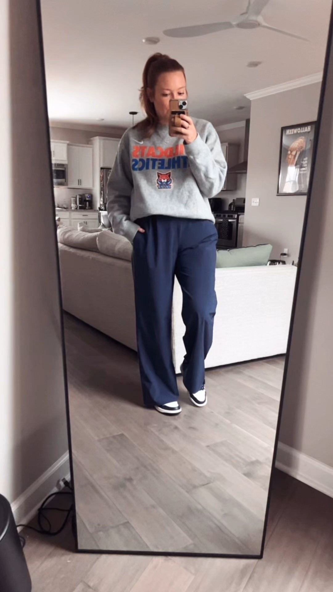 Game day outfit 
Nike sweatshirt 
Navy wide leg athletic pants / tts wearing a medium 
Navy and white sneakers / tts 

#LTKootd #LTKSaleAlert #LTKActive