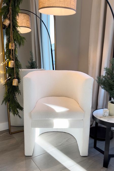 Hey friend! I’m Decking the halls with the chicest finds! 🎄✨ These neutral barrel accent chairs in boucle and linen are the perfect cozy corner addition. Sprucing up my space for the holidays with faux pine garlands, a jingle of gold cow bells, and an arched gold mirror for that extra sparkle. Plus, Amazon's budget-friendly drapes make my space feel grand. And you know I've got those scented candles on deck for ultimate coziness. 
Scroll down below if you’re Ready to shop for your festive oasis? 🏡🕯️ 
#holidayDecor #Accentchair #Christmasbells #Archedmirror #homedecor

#LTKstyletip #LTKsalealert #LTKhome