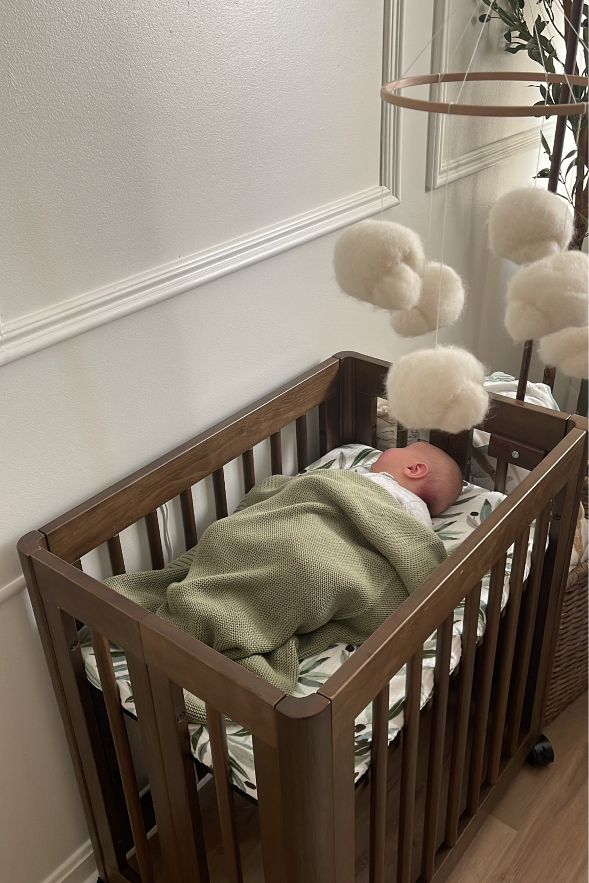 Mobile on baby boy’s bassinet
