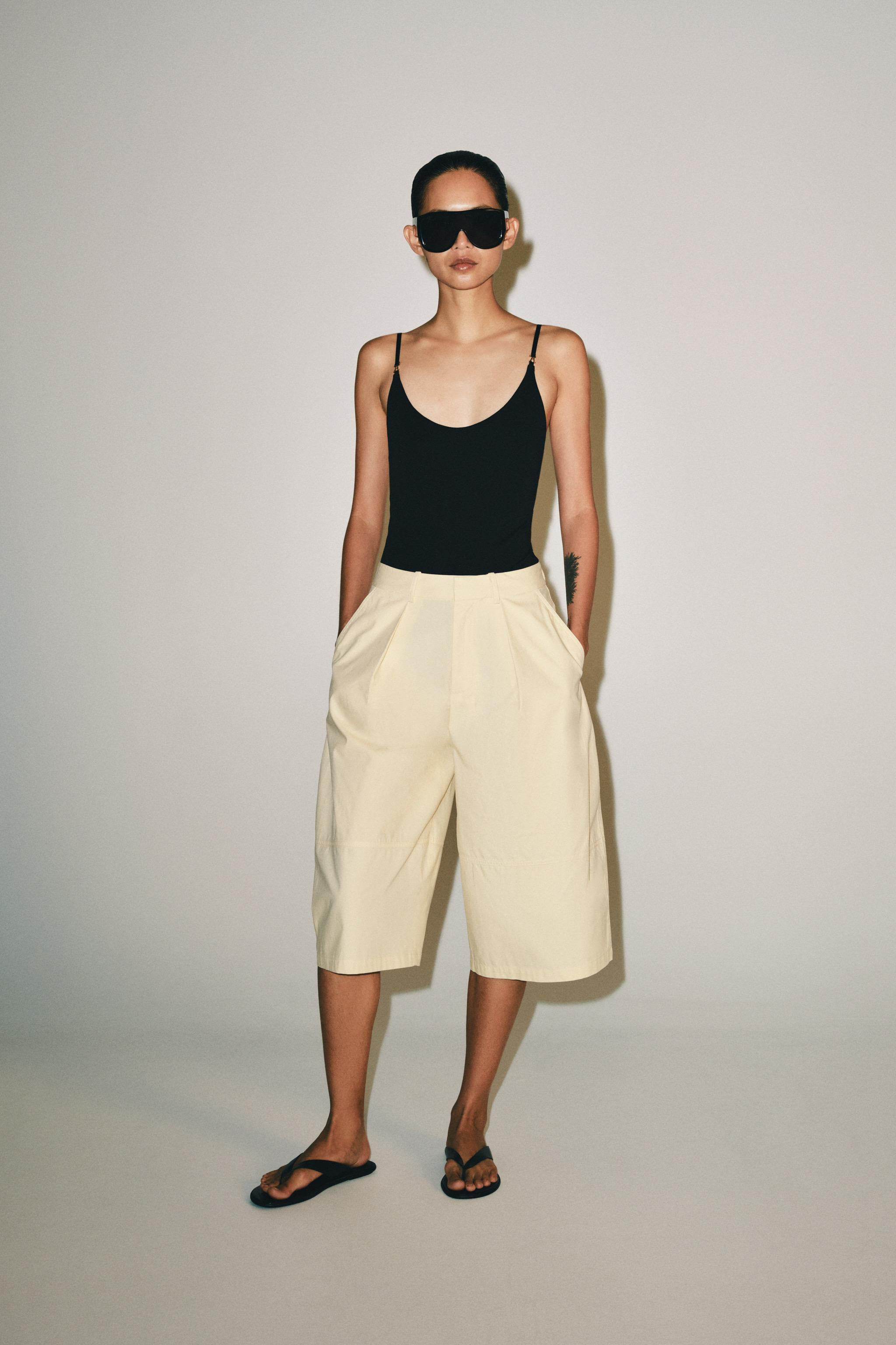 Bodysuit made from a cotton blend. Features a round neckline and thin straps. Snap-button closure... | Zara US
