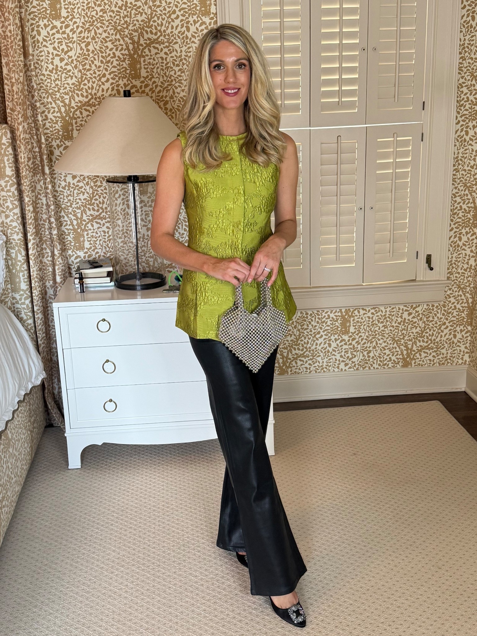 Love this top paired with coated skinny flare jeans and a pop of silver 

#LTKOver40 #LTKgrwm #LTKHoliday