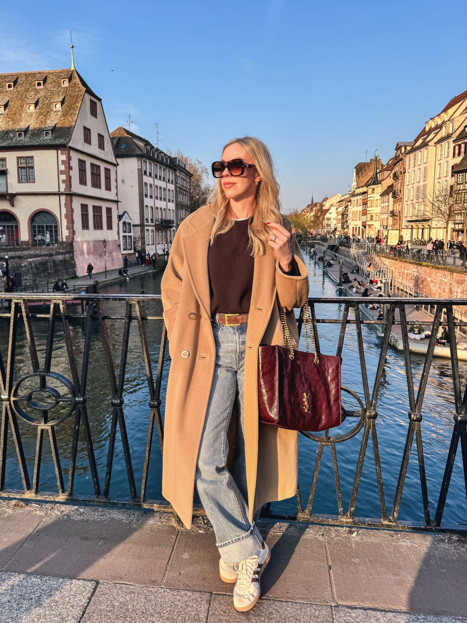 Travel outfit, camel coat, @Levi's cuffed baggy 90’s jeans, suede YSL belt, Adidas Samba sneakers, burgundy YSL tote bag

#LTKTravel #LTKSeasonal #LTKOver40