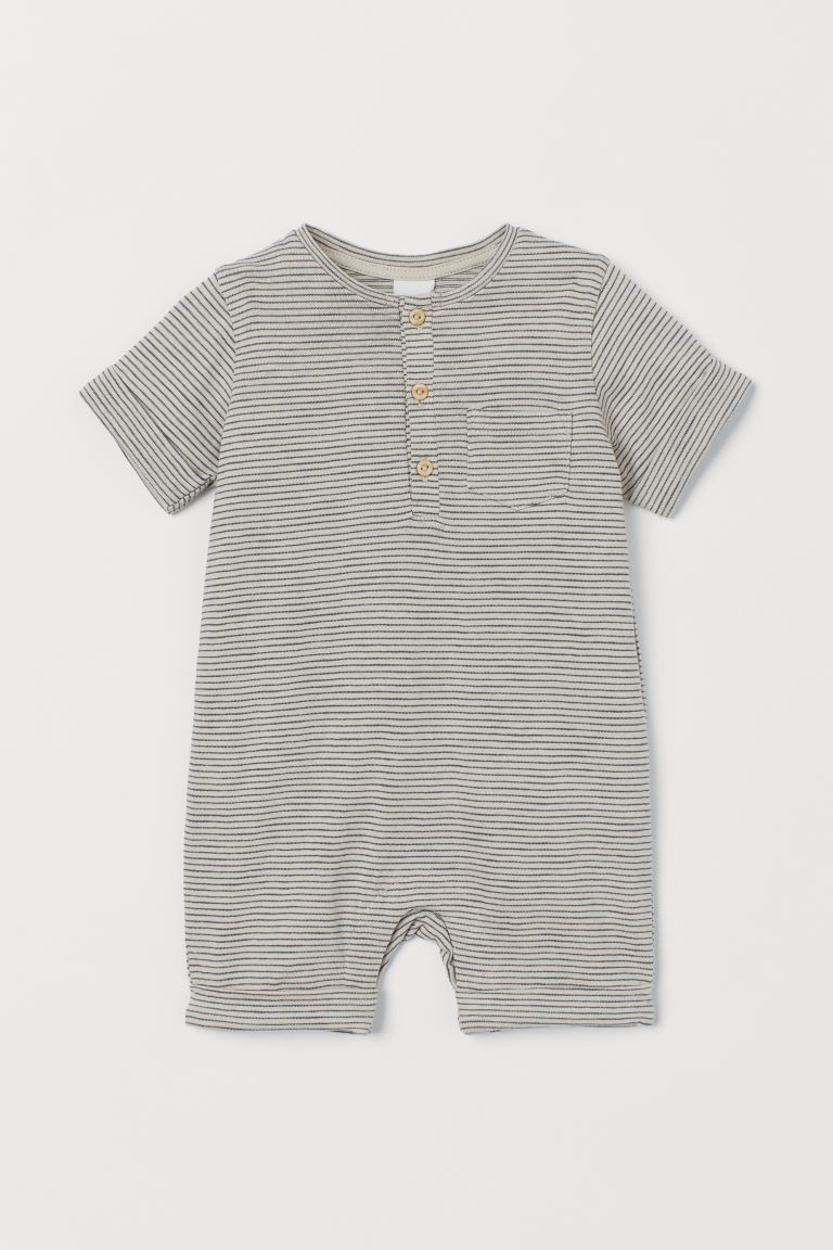 Baby Exclusive. Romper in soft organic cotton slub jersey with a button placket and chest pocket.... | H&M (US + CA)