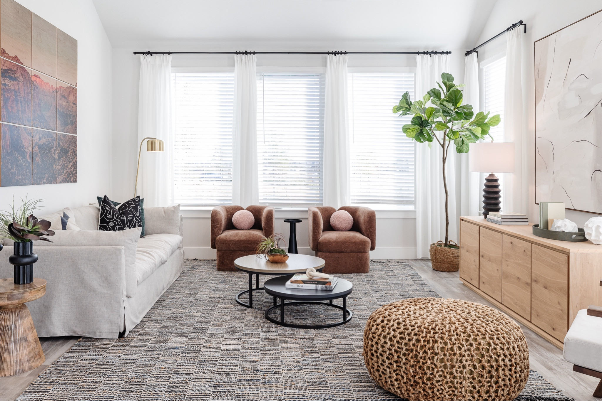 Shop this living room full of rich texture and subtle color.  We love the rust chairs and blush boucle round pom pom pillows. 💕

#LTKFamily #LTKStyleTip #LTKHome