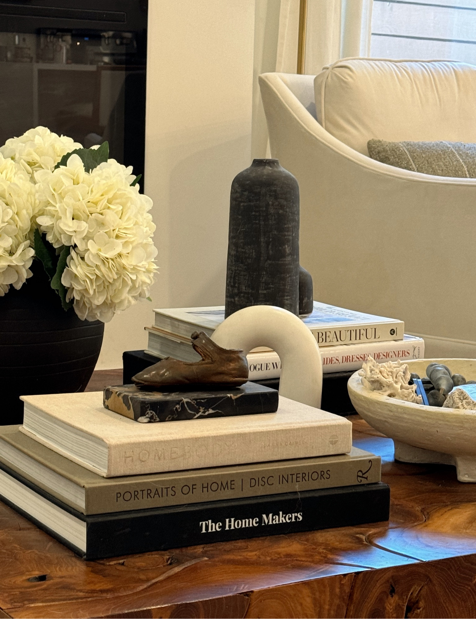 Current Coffee Table Styling | when shopping for home decor, I look for organic textures like marble, wood, and linen. Textures bring out personality in neutral color styling. Pictured are my favorite coffee table books, bowls, candles and vases. Amazon and Target mixed with antique/vintage pieces. 