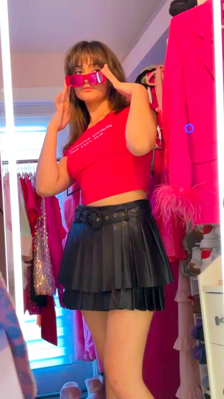 Valentine’s Day outfits: Girls Night Out edit. 
This black pleather vegan leather pleated skort is a closet staple. Small clear pink hoop earrings, fun pink sojos sunglasses, and a black finishes the look. 
Dress it up with cute heels or dress it down with funky boots or casual sneakers. 

#LTKfindsunder50 #LTKVideo #LTKparties