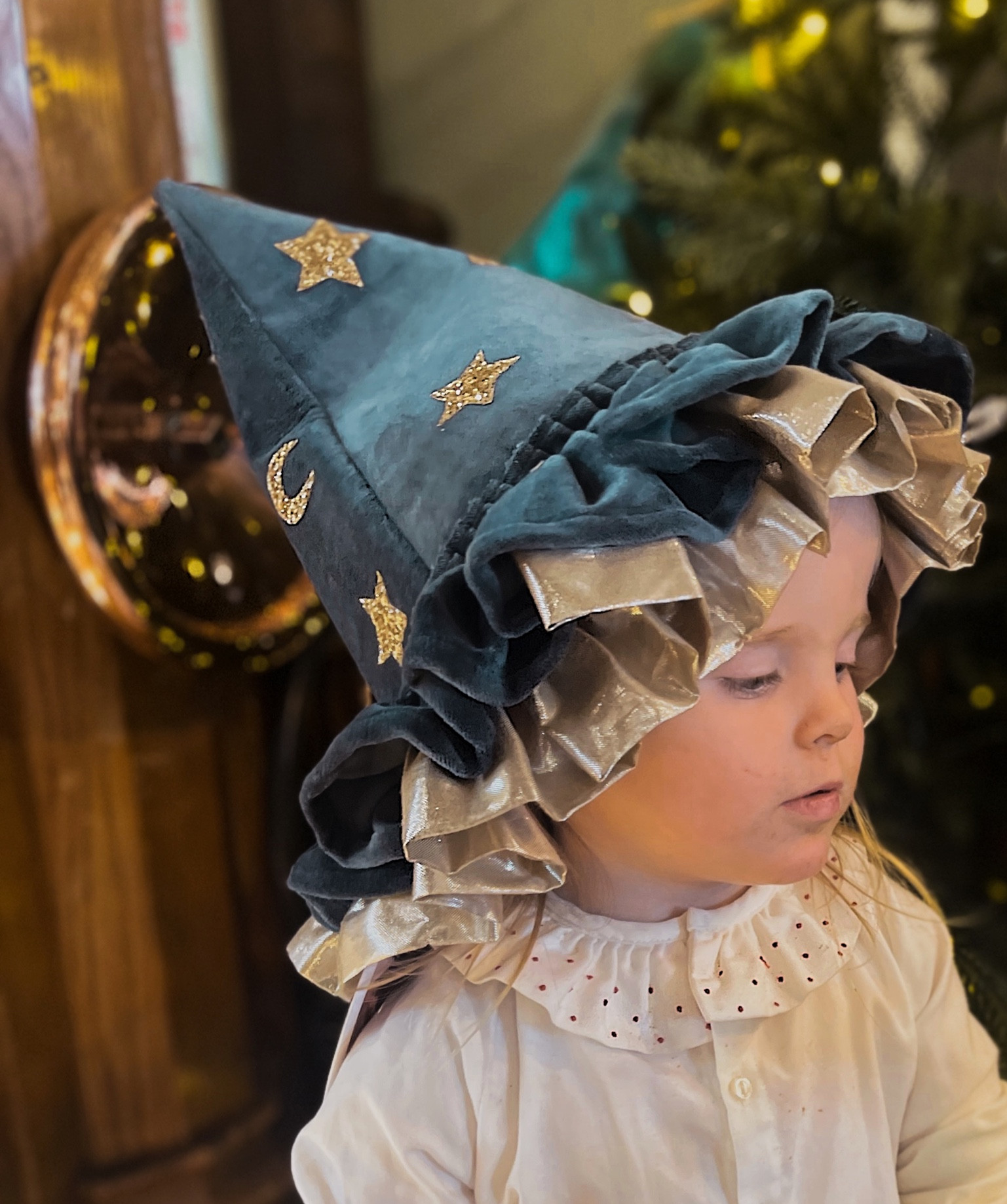 The most stylish , unique witches hat with pretty ruffles crafted with blue velvet , gold glitter stars and moons ! Perfect for Halloween or imaginative play .
#halloween #withes hat #dressingup 

#LTKfamily #LTKkids #LTKHalloween