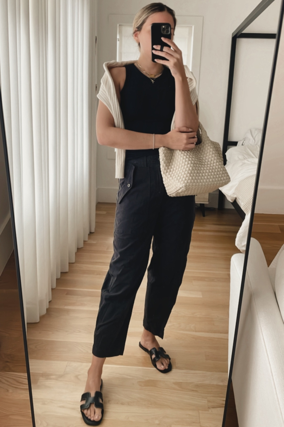 Black tank and black cargo pants 