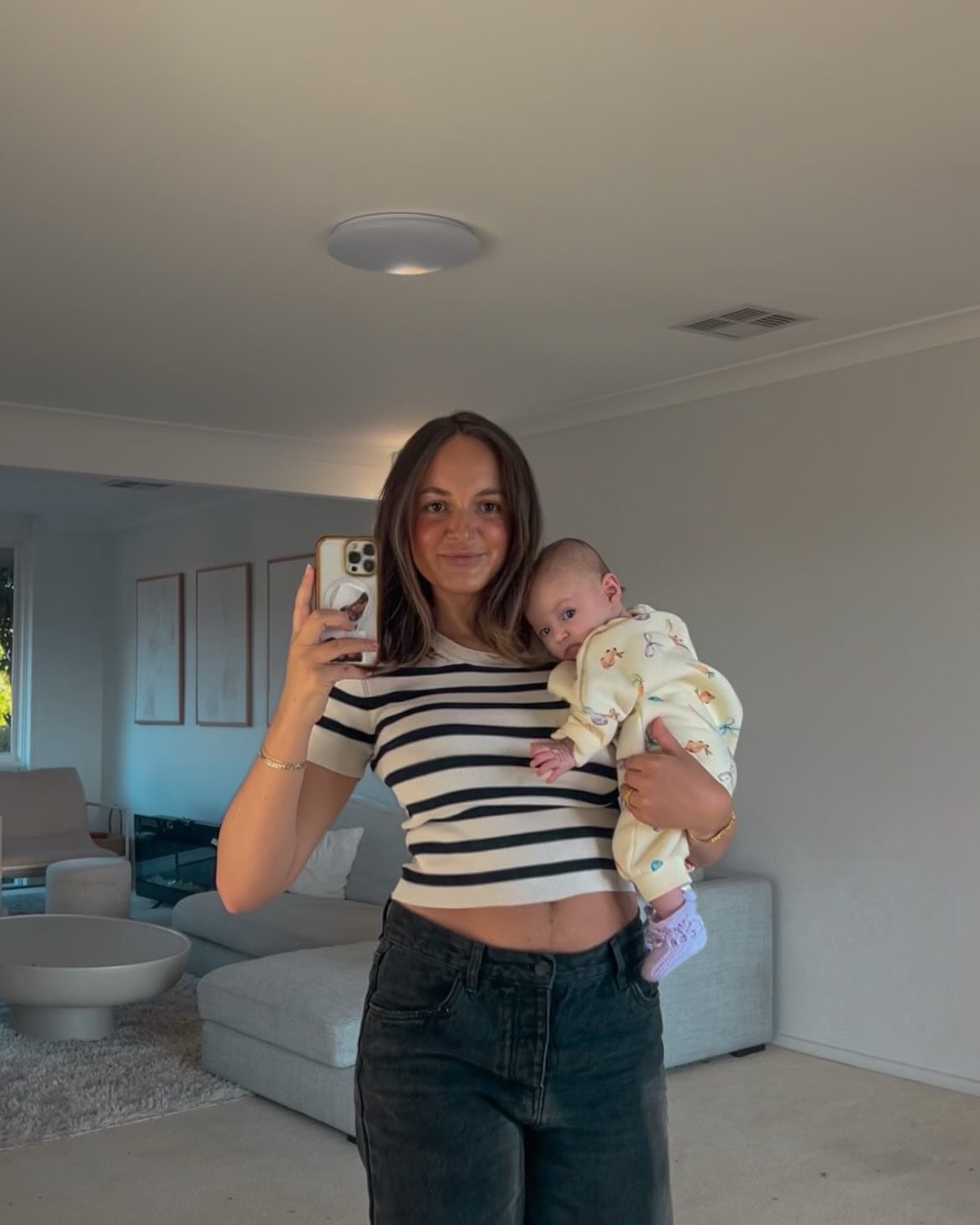 Plucking up the courage to head out in the Sydney winter and this crazy weather.

These jeans were a super baggy low fit pre pregnancy and are now a slightly more snug mid rise post partum. Wearing an AU 8

Layering is my besties so I added a black boot and grey coat to this look.



#LTKwinter #LTKaustralia #LTKbaby