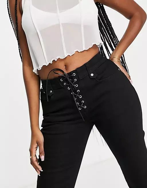 ASOS DESIGN Hourglass low rise stretch flare jeans with lace up in black | ASOS (Global)
