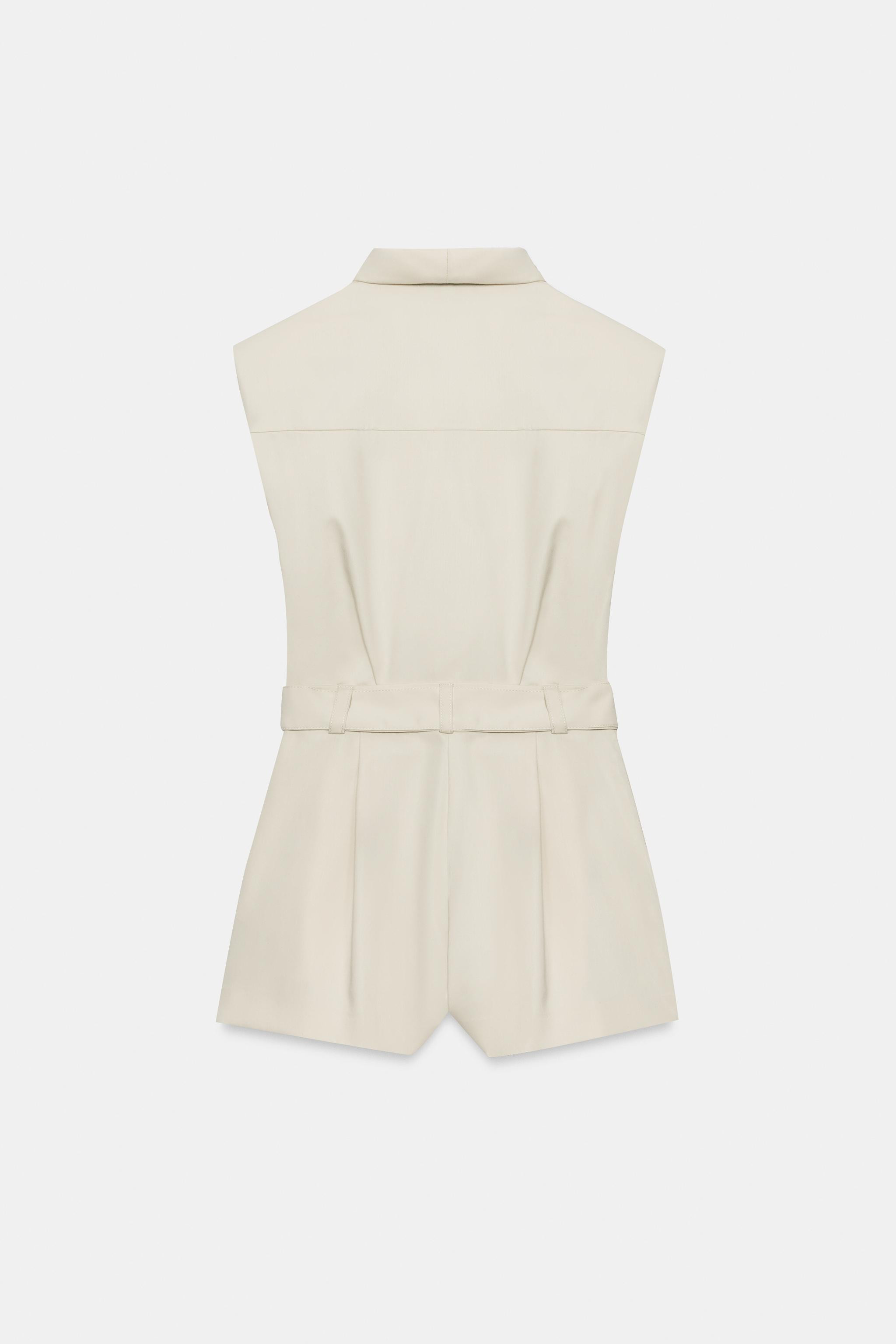 Draped, sleeveless surplice neckline playsuit with shoulder pads. Featuring front pleat details a... | Zara UK