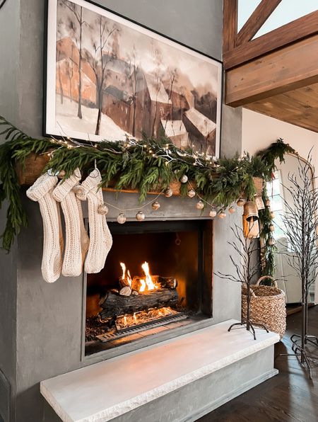 Mantle styling with garland, stockings, bells and pre lit branches 

#LTKhome #LTKSeasonal #LTKHoliday