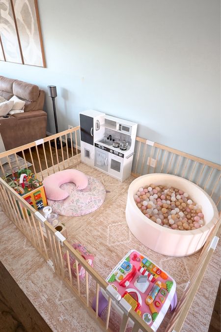 Toddler play area ideas! Ball pit, play kitchen, Montessori toys, wooden play pen, house of noa play mat, activity table,  love very toys, baby play area, 1 year old gift ideas #ltkfindsunder50 #ltkhome

#LTKfamily #LTKkids #LTKbaby
