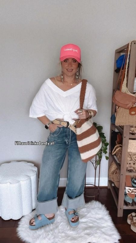 Let’s spiff up a basic white tee 
Tee size L ( I would stay TTS, mine is a little big) 
Tank M/L
Jeans sized down one 
Sandals TTS 
Summer tote, woven tote bag, free people jeans, cuff jeans, white tee, v neck tee, oversized tee, trucker hat, summer style, spring style, platform sandals, denim sandals 

#LTKVideo #LTKover40 #LTKstyletip