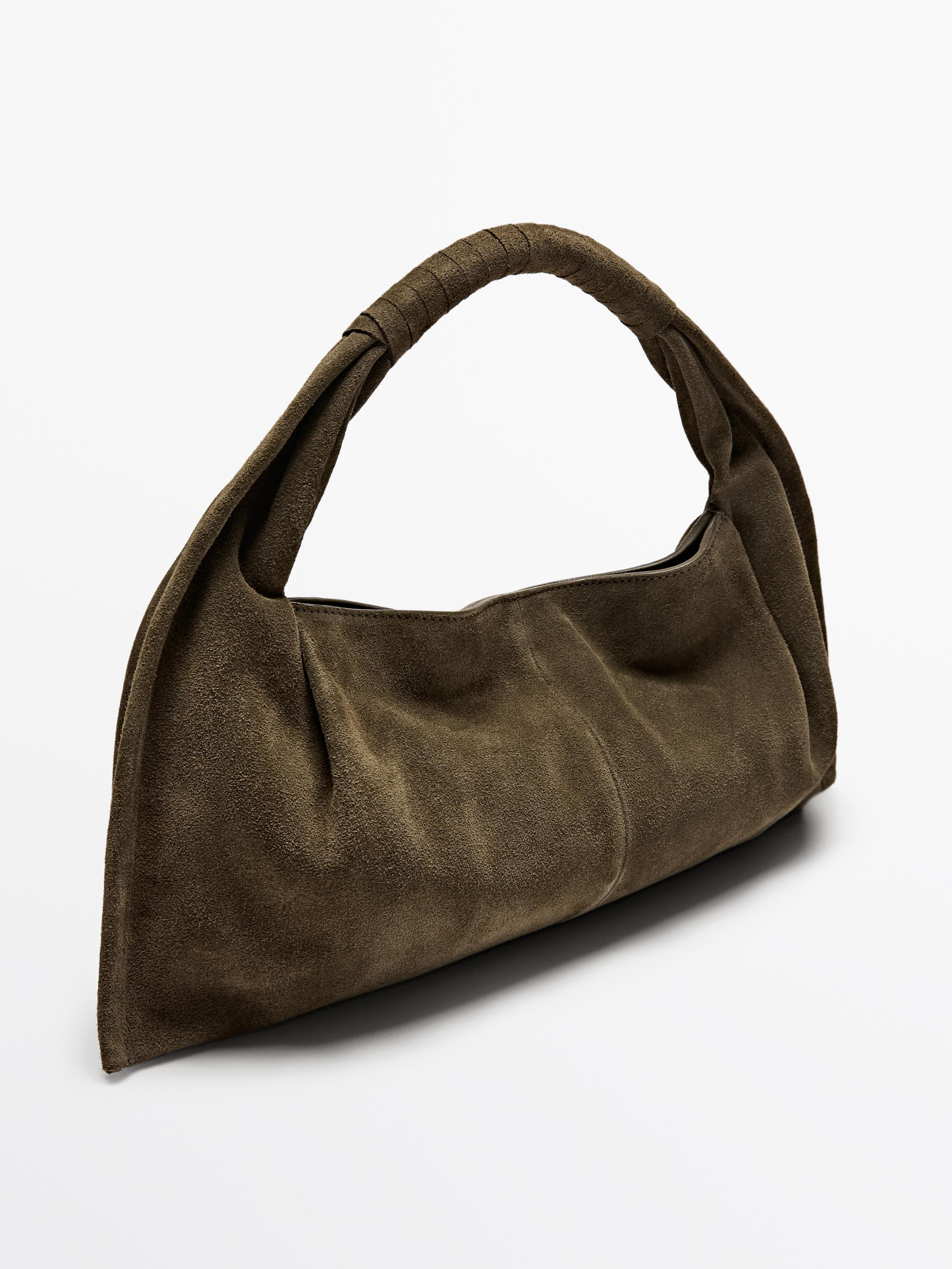 Handbag made of cowhide with a split leather finish. A handle/shoulder strap. Fastens with a hidd... | Massimo Dutti US