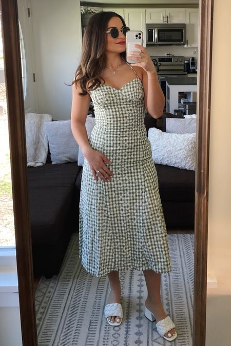 The perfect spring picnic dress 🌾🍓 Wearing XS, could have done S for a more comfortable fit!

Lulus dress, green gingham dress, halter dress, halter midi dress, spring dress, summer dress, white sandal heels, block heels, chunky block heel, vacation heels, bridal shower heels, round sunglasses, spring outfit 

#LTKfindsunder100 #LTKtravel #LTKSeasonal