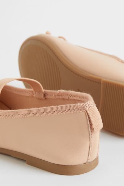 Ballet flats in faux leather with grosgrain trim at upper edge. Elastic foot strap, decorative bo... | H&M (US)