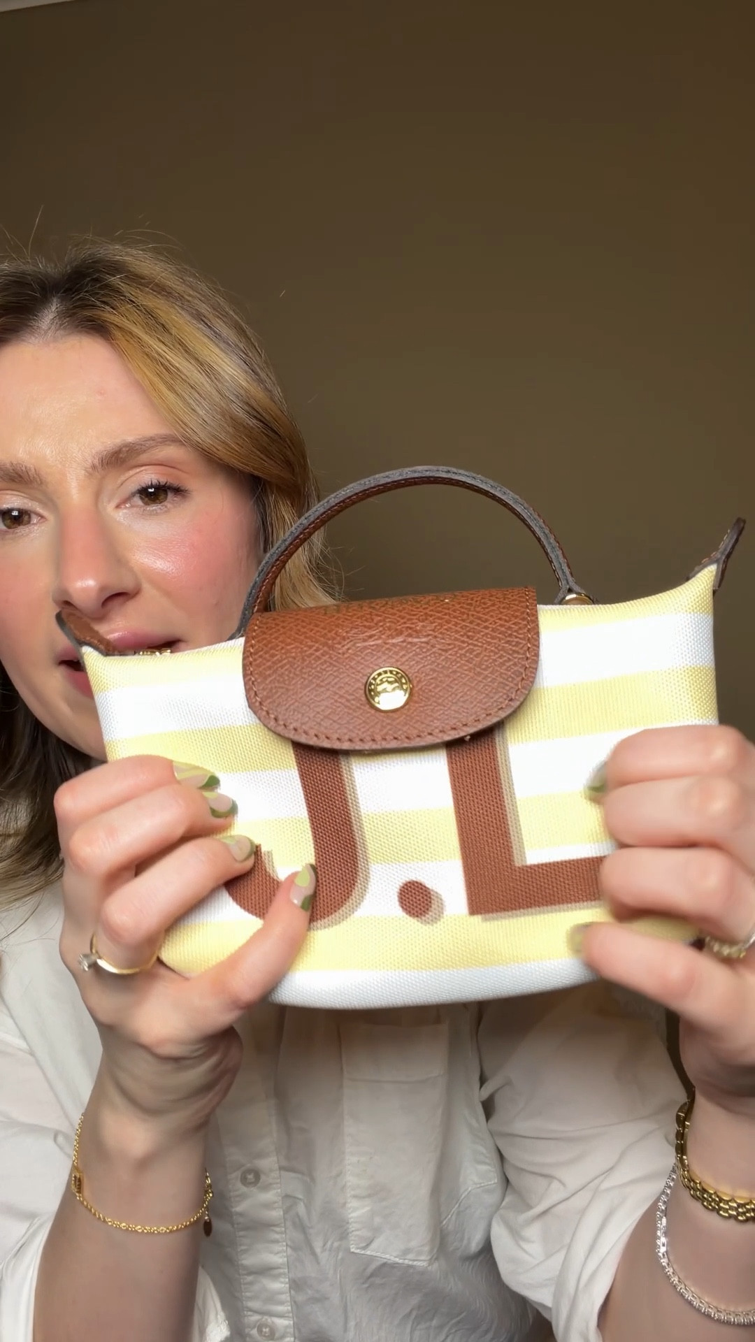 Do you know you could customize a Longchamp Le Pliage tote?! I did a small one last year but love that they added the mini pouch as an option.

It comes with built in hooks on the handles and a crossbody strap so no need to buy a crossbody strap kit!

I made my Longchamp pouch white and yellow stripes with brown leather trimmings to match my heritage editions bronco and I’m obsessed! I love matching my bag with my car lol

You can make your bag a solid color or add stripes or a heart shape. You can also add up to 3 initials and change the colors. You pick your leather trimming color, and hardware color. Then you can get some leather stamping in the flap and also write a note on the inner pocket. This is such a great gift to yourself or someone for Mother’s Day, Valentine’s Day, or Christmas 💗