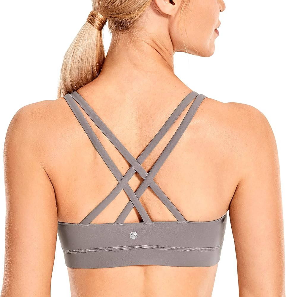 CRZ YOGA Women's Strappy Sports Bras Fitness Workout Padded Yoga Bra Criss Cross Back | Amazon (US)