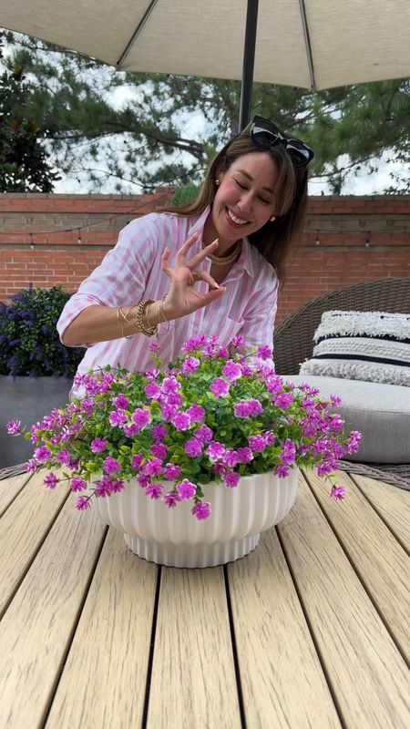 Seriously the prettiest outdoor arrangement for under $45!! I used my Walmart fluted planter and a pack of these gorgeous faux outdoor flowers. 

👉👉They come in a pack of 12 and that’s what I used in the bowl. They are also UV resistant. 

#LTKVideo #LTKHome #LTKSeasonal