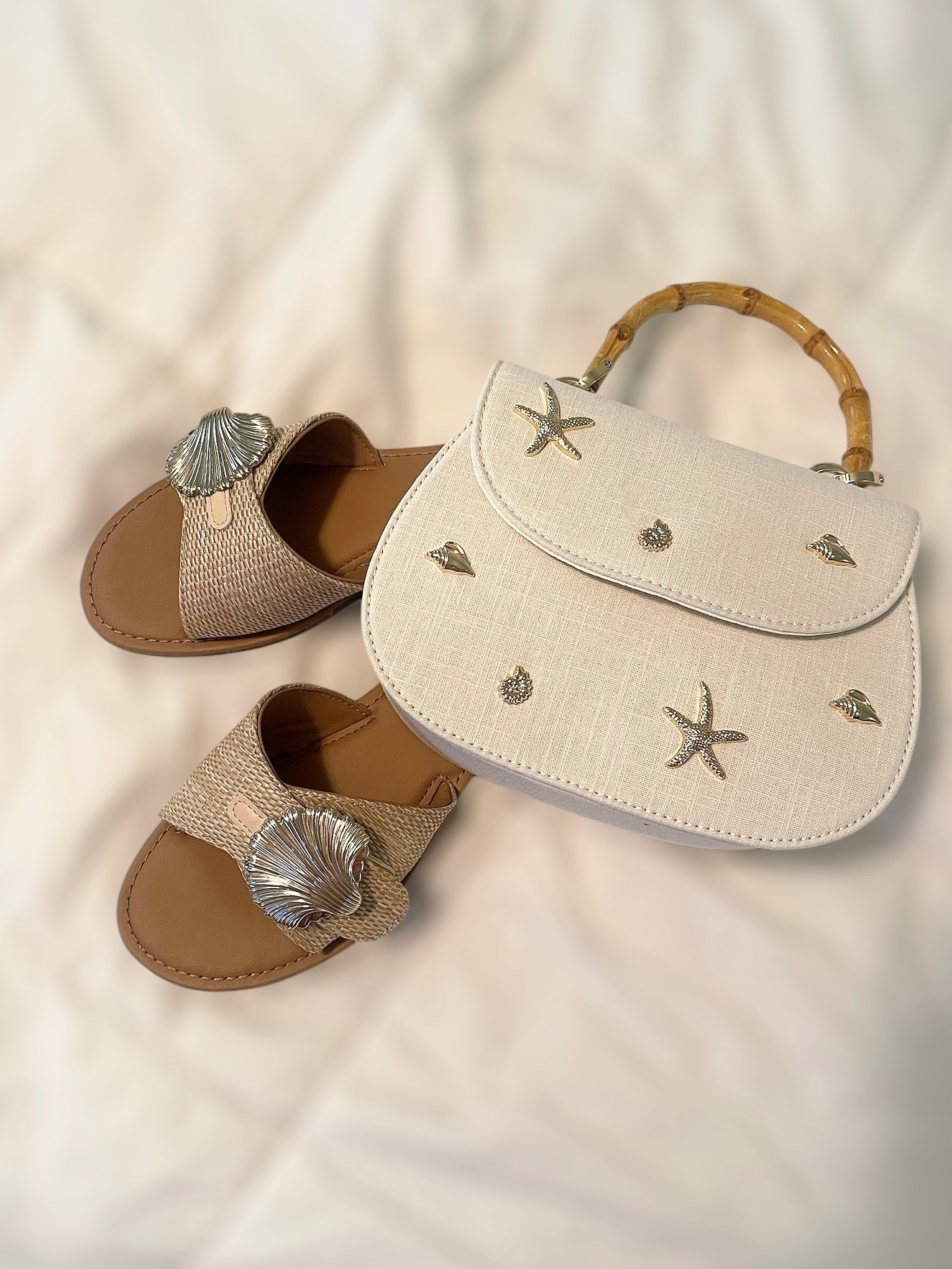 ✨ These beachy Target finds are shore to turn heads! I’m wearing the Universal Thread™ Women’s Nesryn Raffia Shell Slide Sandals in size 7.5 — raffia texture, metallic shell ornament, and cushioned insoles make them the ultimate coastal cuties 🐚🩴. Linked them for just $30!

👜 Paired with the Bamboo Top Handle Handbag from A New Day™ ($25) — the cutest canvas bag decked out in gold-tone sea motifs 🌟🐚🪸 with a structured silhouette and magnetic flap. The bamboo handle gives it that chic island vibe 🍹🌴.

🔗 Perfect combo for beach days, brunches, or your next seaside stroll! Linked both on my LTK 💛

#TargetStyle #BeachReady #CoastalAccessories #SummerStyle #ShellYeah #LTKunder50 #LTKsummer #LTKshoecrush #LTKbaglove #TargetFinds #PreppyStyle

#LTKShoeCrush #LTKItBag #LTKFindsUnder50