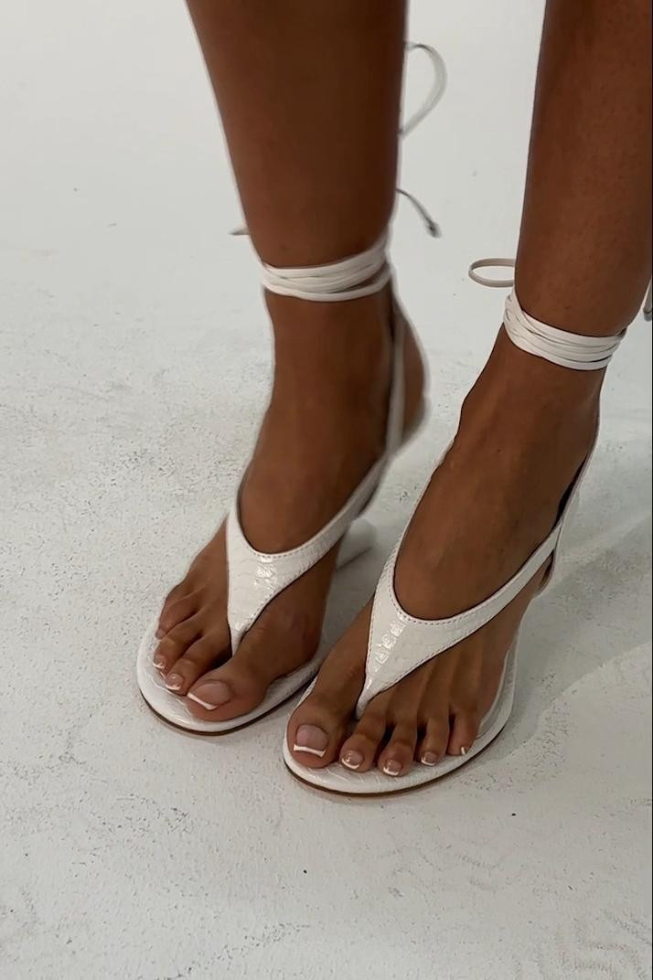 Tired of plain white heels that don’t make enough of a statement? The AZALEA WANG Tamsin White Croc Novelty Wedge Strap Sandal combines croc-inspired texture with a bold novelty wedge and strappy silhouette for an eye-catching finish. Perfect for birthdays, vacations, brunch, girls’ nights, date nights, or all-white party looks, pair them with mini dresses, denim, jumpsuits, or matching sets. 

 #LTKdayinmylife #LTKvlog #LTKOver40