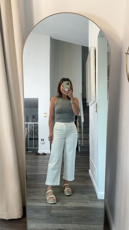Loving these white cropped wide leg jeans via Madewell! They are so good and so perfect for summer! They make the 🍑look so good! 
Tank top size xs. $8 only! And feels like $100! 
Jeans size 24. They are super stretchy so I went down one size. 
Take $20 off my sandals right now!
Vince Camuto, white jeans, tank top, ribbed tank top, target, target finds, wide leg jeans, dad sandals, summer outfit

#LTKFindsUnder100 #LTKShoeCrush #LTKSaleAlert