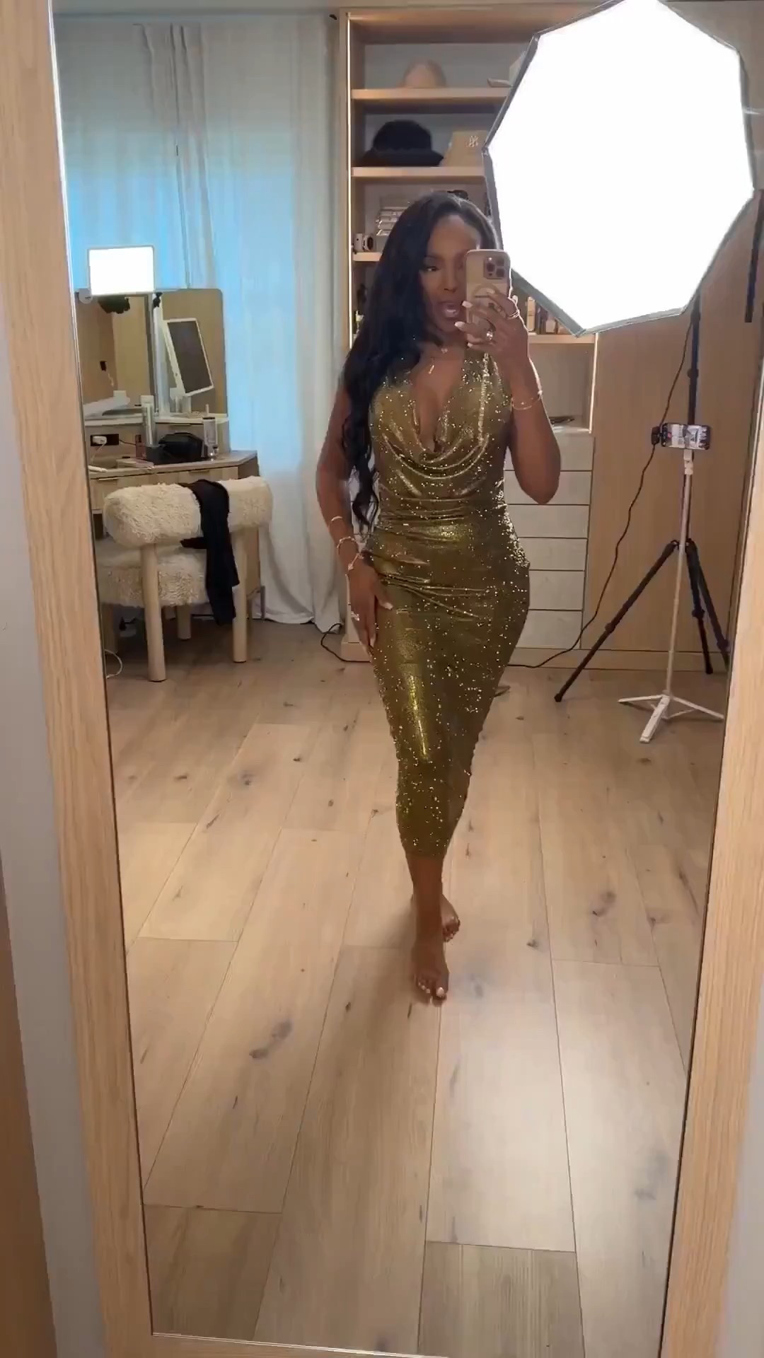 A show-stopping gold moment — this metallic dress drapes beautifully with a plunging cowl neckline and a sculpted silhouette that hugs every curve. The shimmer catches the light with every step, making it the ultimate statement piece for glam nights.

Perfect for holiday parties, New Year’s celebrations, and any event where you want to walk in glowing.

📏 Sizing: dress (small)  
Height 5'4" · 138 lbs · 34D bust · 27" waist · 40" hips

gold metallic dress, holiday party outfit, New Year’s Eve look, glamorous evening dress, curve-hugging event style, sparkly statement dress

Favorite to revisit later.

Follow me on Instagram and YouTube @kirasfashionfinds


