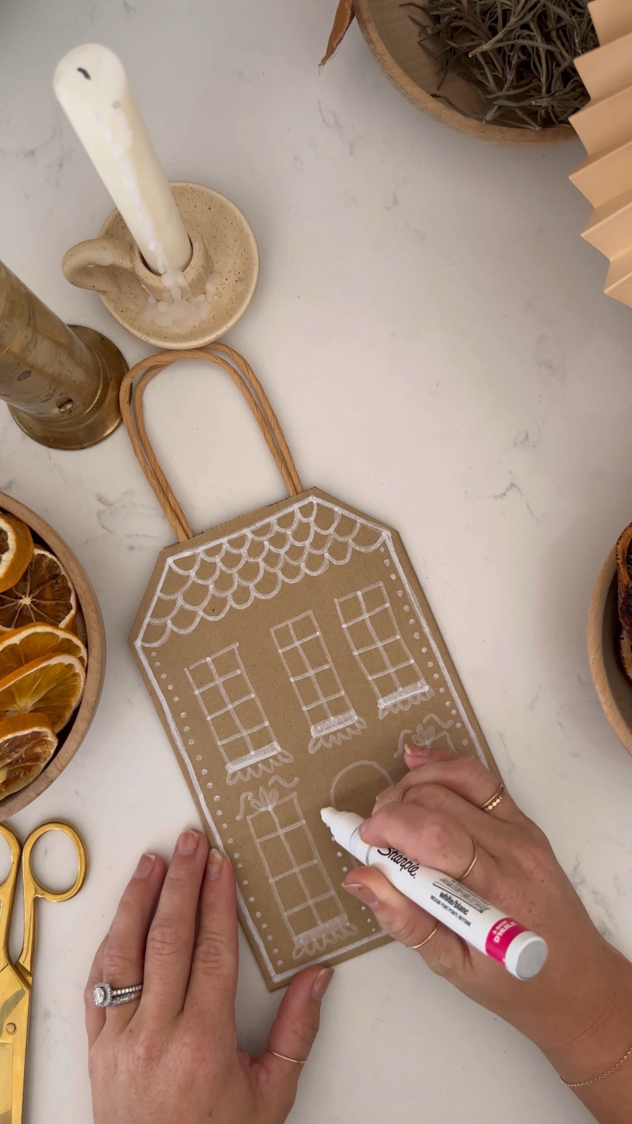 easy diy gingerbread house gift bags! All you need are kraft paper bags, white paint pens and a pair of scissors  

we use these for teacher gift bags and for neighbor gifts!

#LTKGiftGuide #LTKSeasonal #LTKHoliday