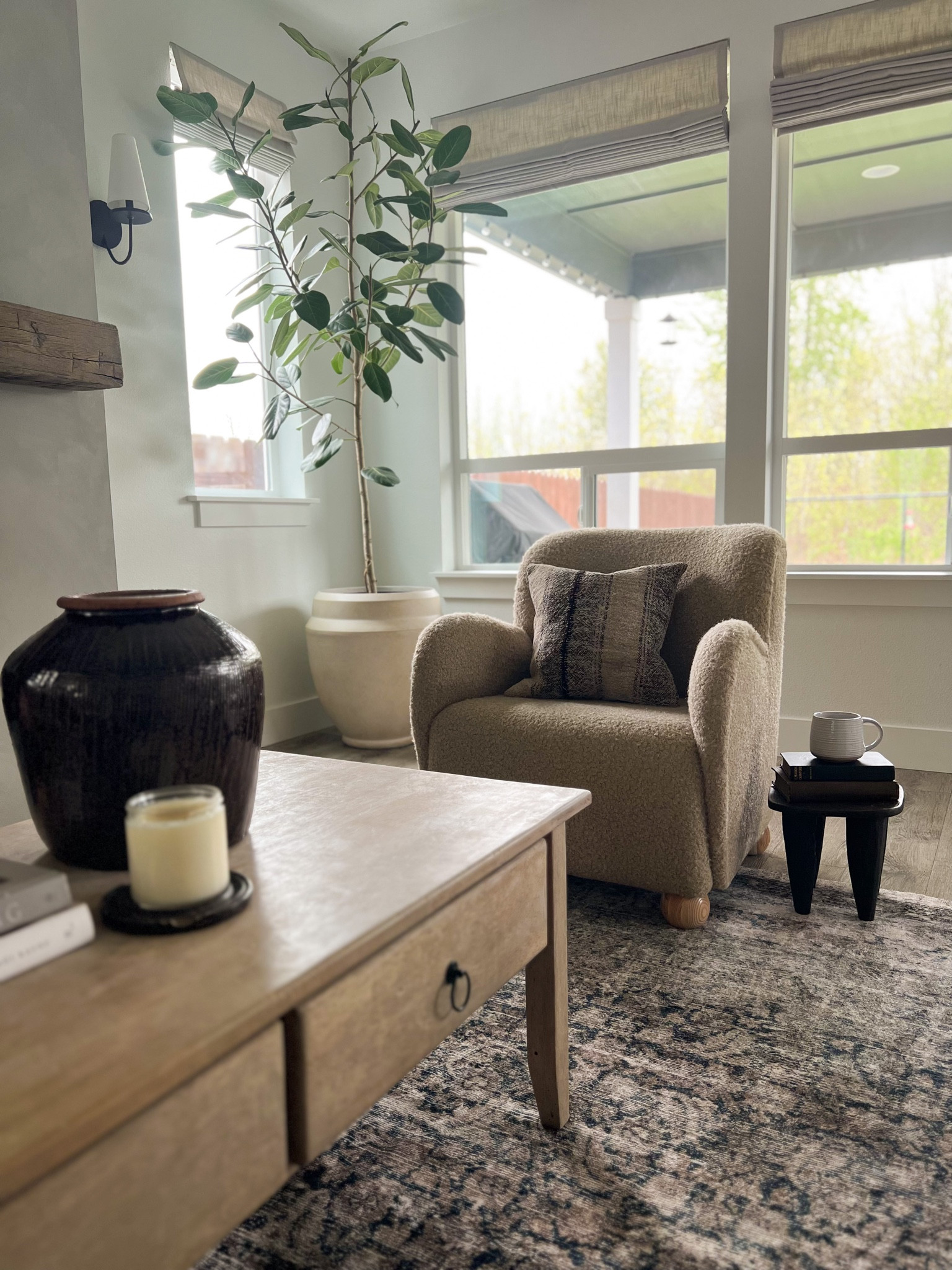 Armchair, amber interiors rug, senufo stool, glazed clay vase  

#LTKhome #LTKFind